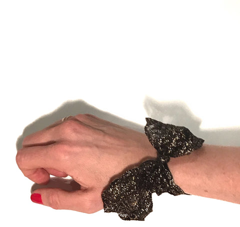 Black Luxe Lace Tail Band on wrist. Bandtz hair tie handmade from high end elastic lace trim. Hair tie bracelet. Hair tie jewelry for women.