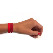 Two demi-dot Bandtz hair bands in red shown on wrist. Hair bands from the Bandtz Nina Set.  Chic hair tie bracelet. 