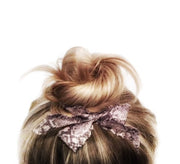 Hair bow in top knot. Bandtz snake print hair bow from Harlow Set. Sexy hair elastic. 