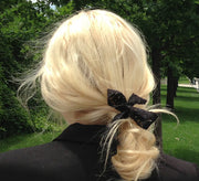 Blond wearing Bandtz lace hair bow. 